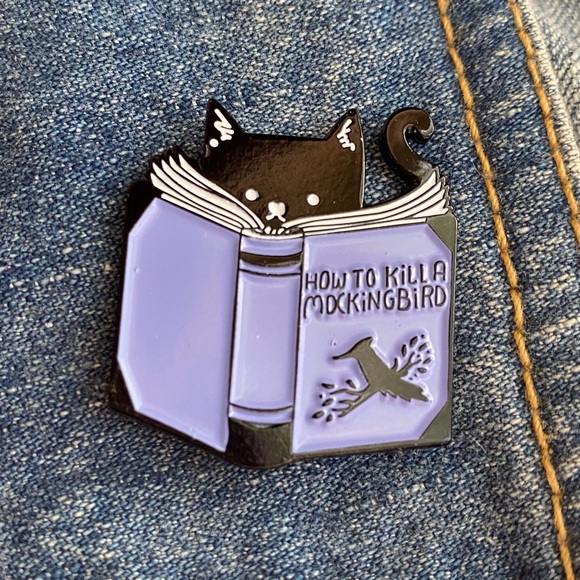 Cat reads “How to Kill a Mockingbird” - Picture 3 of 8